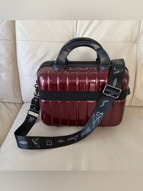 Burgundy hard-shell bag